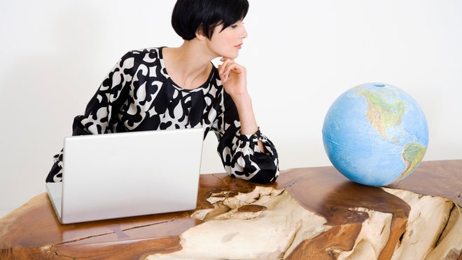 Woman with laptop connecting globally